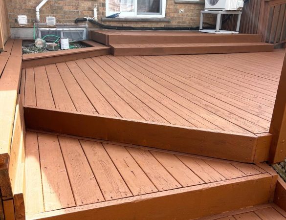 Close-up of a newly painted wooden deck with a smooth, even finish, highlighting the professional quality of Fit Painting's deck staining services in Kitchener-Waterloo.