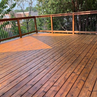 Lightly stained wooden deck with a clean, even finish, exemplifying Fit Painting's expert deck staining services in Kitchener-Waterloo.